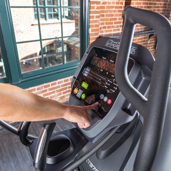 Exerciser using the XT3700 standing elliptical console