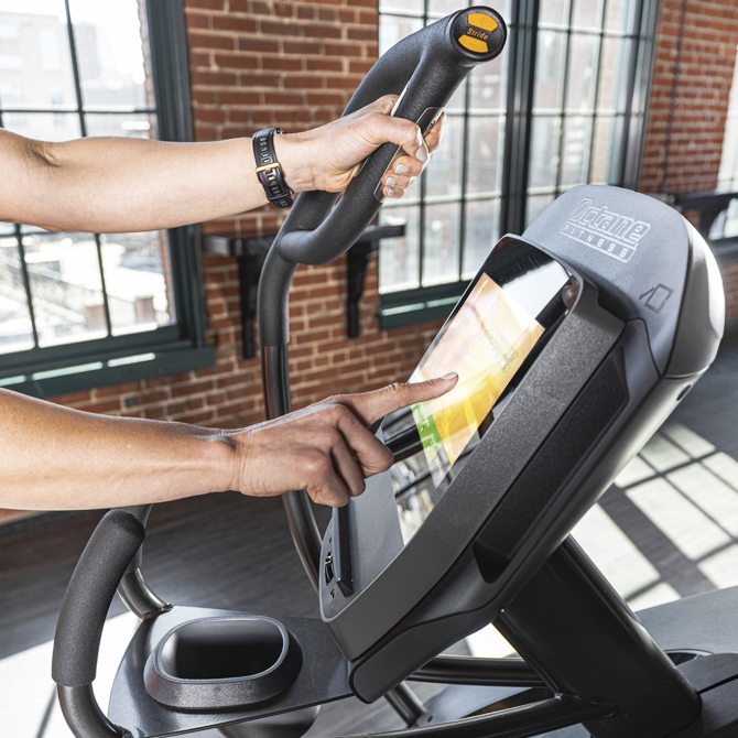Exerciser using the XT4700 standing elliptical console