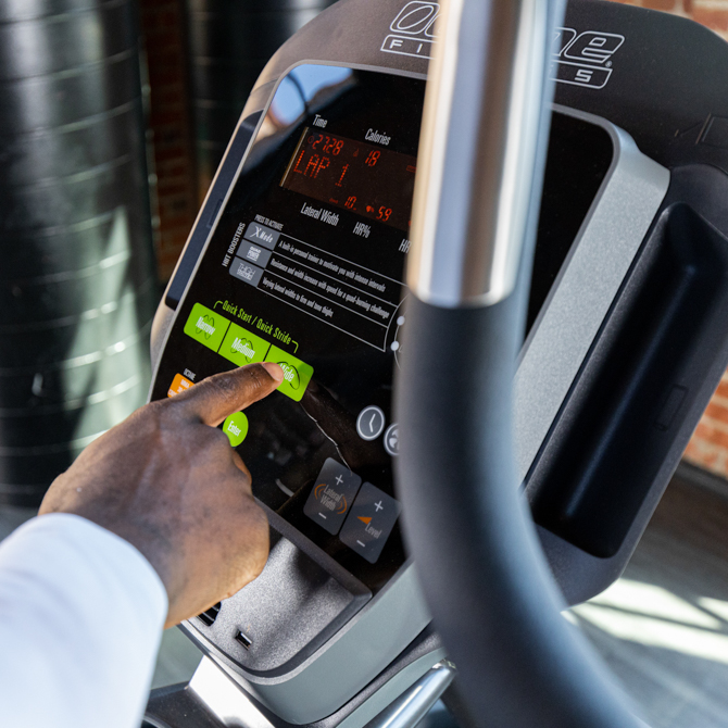 Man using lateral elliptical console