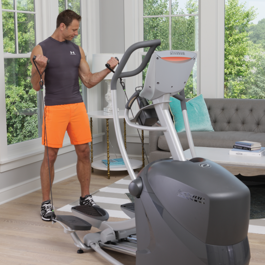 Man using the CROSS CIRCUIT+ Kit while working out on the Q37x standing elliptical