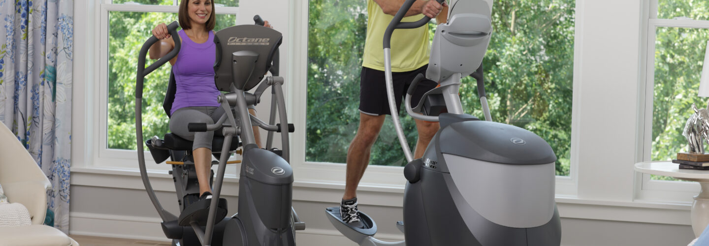 Woman and man working out together on Octane ellipticals